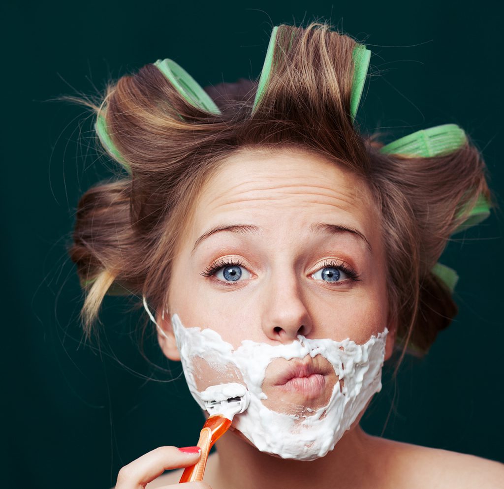 woman shaving face